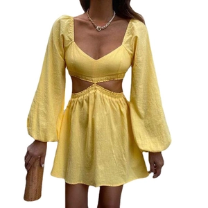 Light yellow A-line dress with V-neckline, waist cut-outs and puff long sleeves