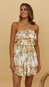Close-up of floral off-shoulder mini dress with ruffles and yellow flower pattern