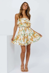 Close-up of floral print mini dress showing tiered ruffle neckline and waist detail