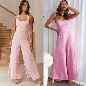 Detail of the backless halter design and high waist on pink wide leg jumpsuits