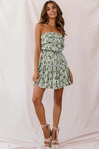 Detail of floral off-shoulder mini dress with ruffles and olive green flower pattern