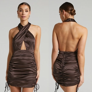 Detail of chocolate satin ruched mini dress showing halter neck and open back design