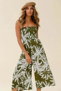 Close-up of ruffled square neckline and palm leaf print on army green summer jumpsuit