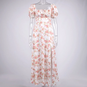 Detail of floral printed French dress showing square neckline with drawstring and puff sleeves