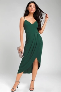 Detail of dark green V-neck dress featuring elegant side ruching and asymmetric tulip hem