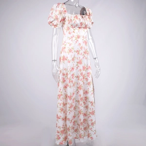 Close-up of white floral French dress with puff sleeves and square neckline details
