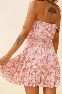 Detail of floral print mini dress showing tiered ruffles and elasticated waist from back