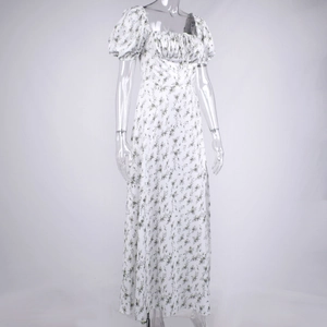 Detail of white floral maxi dress featuring vintage square neckline and puff sleeves