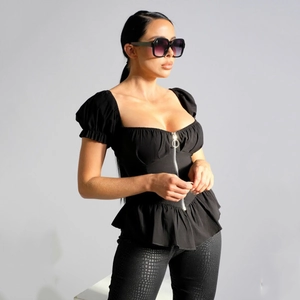 Women's slim fit black blouse with front zipper, puff sleeves and ruffled hem detail