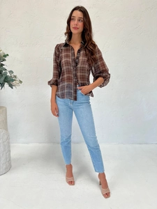 Detail view of brown plaid chiffon blouse with classic collar and sheer textured fabric