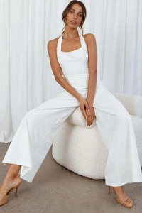 Detail view of white halter neck wide-leg jumpsuit with elegant backless design