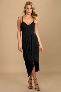 Detail of elegant black V-neck slip dress featuring asymmetric pleated skirt with side slit