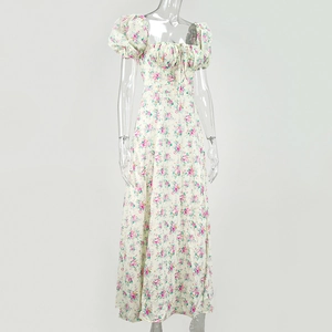 Detail of floral print maxi dress with puff sleeves and ruched drawstring neckline
