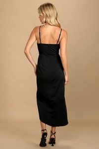 Detail of the back hidden zipper and sleek satin fabric on a black midi slip dress