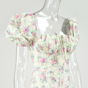 Detail of square neckline with drawstring and puff sleeves on floral French dress