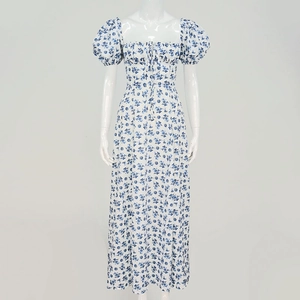 Detail view of floral midi dress featuring sweetheart neckline and puff sleeves