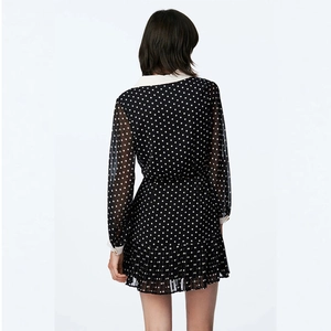 French vintage black polka dot chiffon dress with white collar and ruffled hem back view