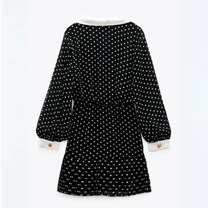Polka dot chiffon dress with white collar and gold buttons, rear flat lay view