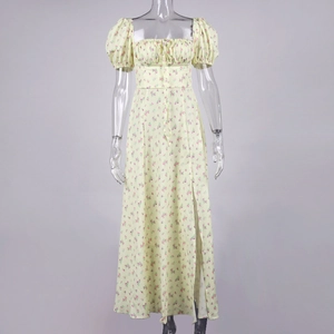 Detail view of floral midi dress with puff sleeves, square neck and thigh-high side slit
