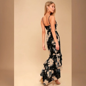 Elegant floral spaghetti strap maxi dress with backless design and ruffled fishtail hem