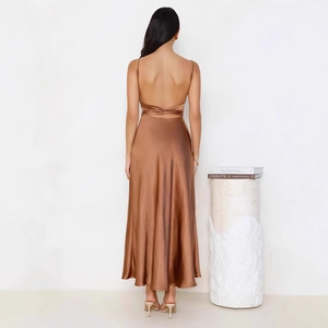 Close-up of bronze satin midi dress showing backless cross bandage detailing