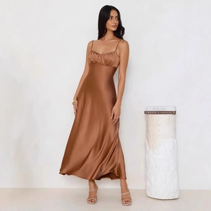 Detail view of brown satin long dress showing silk texture and delicate strap design