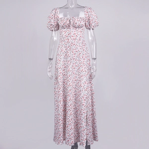 Detail of floral print maxi dress with square neckline and side slit on white fabric