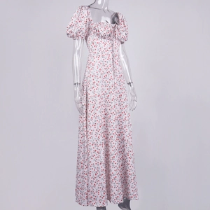 Detail of floral French slit maxi dress with square neck and puff sleeves on mannequin