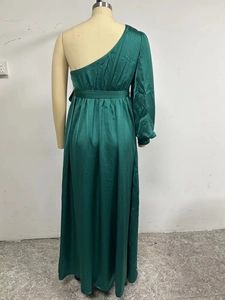 Elegant dark green one-shoulder satin maxi dress with long sleeve and waist tie belt