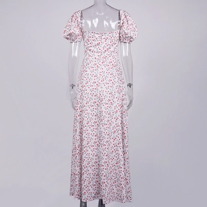 Back view of a white floral maxi dress with square neck and puff sleeves on mannequin