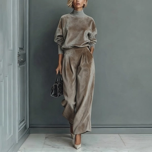 Detail of high-waist velvet wide-leg trousers and long sleeve top in taupe brown