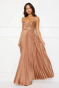 Detail of elegant backless pleat dress with waist cut-outs in copper satin fabric