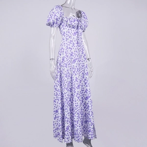 Detail view of square neck, puff sleeves and bow tie on white floral midi dress