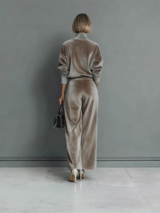 Elegant taupe velvet tracksuit set featuring long sleeve zip-up top and wide leg pants