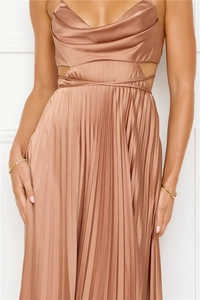 Detailed side view of bronze satin maxi dress with side cut-out and pleated details
