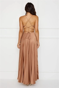 Detailed back view of champagne gold satin maxi dress with criss-cross straps and pleats
