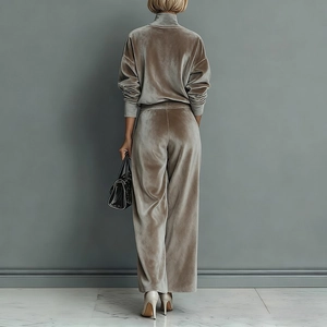 Rear view of women's champagne velvet tracksuit set with high collar and wide leg trousers
