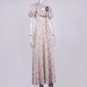 Close-up of floral print pattern on a French square neck puff sleeve midi dress