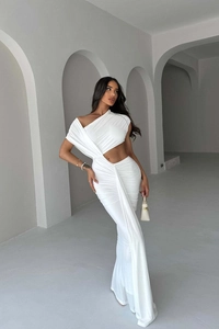 Detailed view of white ruched fishtail dress with hollow-out waist and oblique neckline