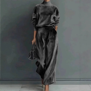 Detail view of charcoal grey velvet set featuring turtleneck top and wide-leg pants