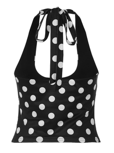 Close-up of vintage halter top with black and white polka dot pattern and tie-neck detail