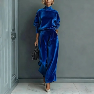 Detail of royal blue velvet two-piece track suit with wide leg pants and high neck top