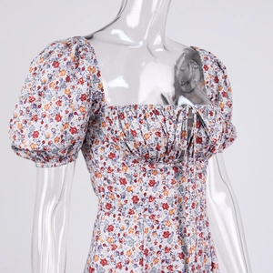 Detail of puff sleeves and drawstring square neckline on floral french slit midi dress