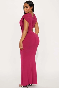 Detail of the side-back cutout and pleated shoulder on a magenta fishtail dress