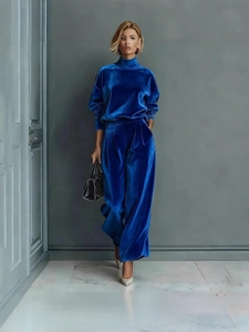 Women's velvet tracksuit set with high-neck zip top and wide-leg pants in navy blue