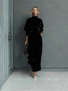 Elegant black velvet two-piece track suit with turtleneck top and wide-leg trousers
