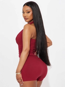 Deep red ribbed knit two-piece set featuring a halter top and high-waisted tight shorts