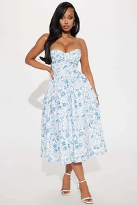 Detail of sweetheart neckline and blue vintage floral print on slim midi dress
