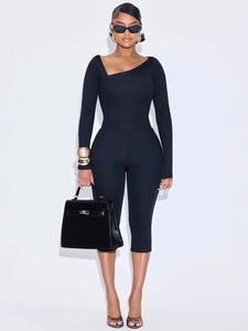 Women's chic black slim fit two-piece set with asymmetric neck top and cropped leggings