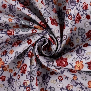 Detailed view of French floral print fabric with vintage roses on soft summer textile